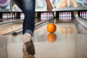 Rolling a bowling ball down a lane